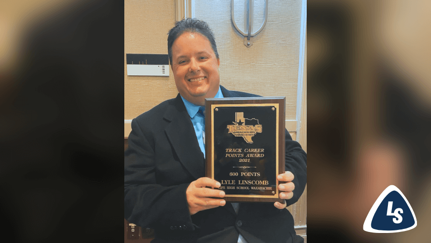 LHSW Head Track Coach Receives '600 Career Points' Track Plaque